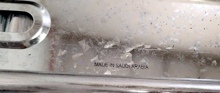 'MADE IN SAUDI ARABIA' printed on a steel hospital-bed frame profile at the Medica-Lab factory in Madinah