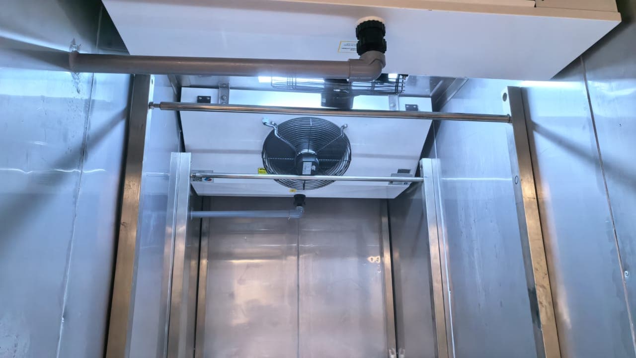 Evaporator fan and cooling coil inside the unit